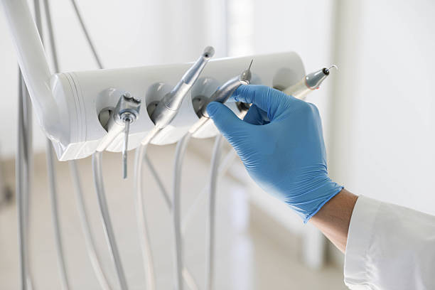 Professional Tooth Extraction technician working in Forest, MS